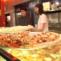 Serving up the pizza's at Voo Doo Rays. at Voodoo Rays - Dalston in East London