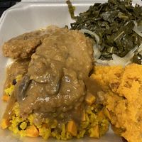 Sweet potato casserole, veggie rice, collards, and seitan chicken and gravy  at Eden's Vegans in Raleigh