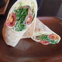 Mediterranean Wrap (ve) Hummus, avocado, rocket, chargrilled aubergines, tomatoes, toasted pine nuts at Smoke  in Wilmslow