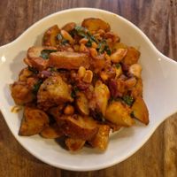 Vegan Smash-Up (ve)(gf): Mini Roast Potatoes mixed with spinach and posh beans. Add vegan sausage at Smoke  in Wilmslow