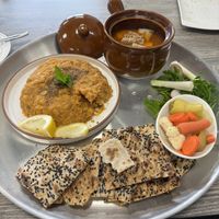 Entree - Persian Dizi: Mixed beans, chickpeas and potatoes mashed up and served with hot sangak bread and a side of tomato based broth and tofu.  at Neek Vegan in Duluth