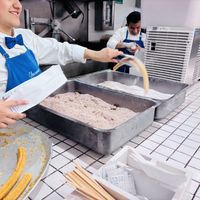 Churro maker  at El Moro in Mexico City