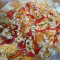 The Silurian - a vegan mac-n-cheese pie with Teese and plenty of garlic and roasted red peppers!  Forgive the blurriness - I wanted to eat it! at Flying Saucer Pizza Company in Salem