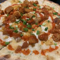 Vegan Nick Fury- vegan chickn, scallions, Alfredo sauce, vegan Mac and cheese, sriracha.  at Flying Saucer Pizza Company in Salem