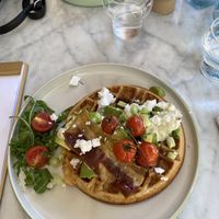 Breakfast waffle with vegan bacon, feta, tomatoes and avocado  at Morning People in Marbella
