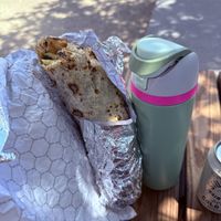 Next to a 22 oz water bottlee  at The Kebab Shop in San Diego