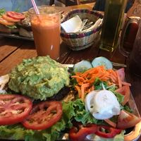 Guacamole black bean burger on an arepa with a side salad. at Brunch de Salento in Salento