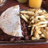 5 bean chili black bean burger with caramelized onions and sautéed mushrooms on an arepa with French fries and homemade ketchup. at Brunch de Salento in Salento