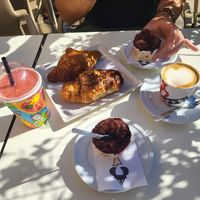 Vegan chocolate ice cream, smoothie, cappuccino, 2 filled croissants: one with berries and one with mango/passion fruit marmelade. at Regina di Coni in Olbia