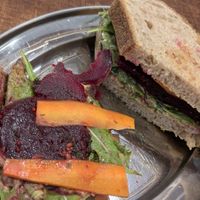Pickled carrot and beetroot on sourdough, garlic and herb cream cheese at Something More Productive in Manchester