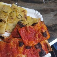 Potato pizza and plain sauce pizza at BONA in Rome