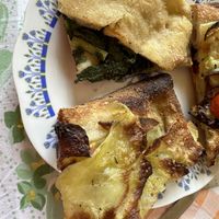 Potato & rosemary pizza & chicory-stuffed pizzaa  at BONA in Rome