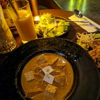 Khao soi, salad and mango smoothie at Mercy Republic in Bangkok