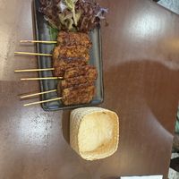 “Meat” sticks with sticky rice  at Mercy Republic in Bangkok