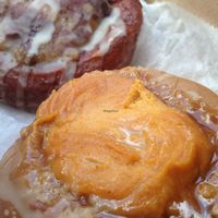 Pumpkin Pie donut in foreground, chocolate peanutbutter in background. It's even better than it looks, yes! at The Cinnamon Snail in New York City