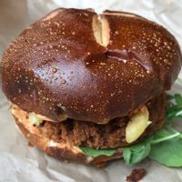 vegan burger in toasted pretzel bun  at The Cinnamon Snail in New York City