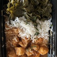 Orange tofu with sides of rice and kale   at Sweet 27 in Baltimore