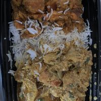 Tomato garlic tofu with sides of rice and sweet potatoes   at Sweet 27 in Baltimore