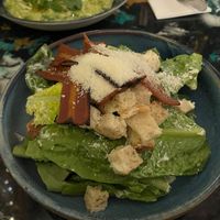 Caesar salad with La Vie bacon and vegan parm at AMPM Restaurant in Belfast