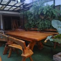 Beside the wall garden is a long table ideal for meeting and discussion at Satya Graha in Los Banos