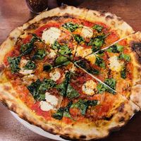 Spinach pizza with macadamia cheese  at Cafe Zorba in Medellin