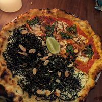 Vegan pizza, half white and half red at Cafe Zorba in Medellin