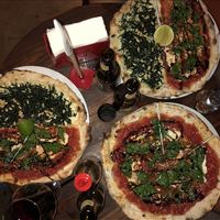 The vegan pizzas. Half spinach/tomato, half kale/macadamian creme. at Cafe Zorba in Medellin