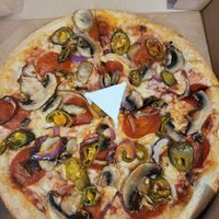 Mushroom, red onion, jalapeño, vegan pepperoni and vegan cheese pizza at Pizza Hut in Newport