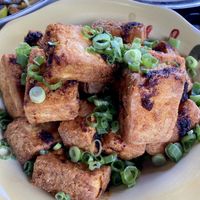 Tofu small plate, the badly needed chili sauce is UNDER the tofu for some strange reason  at 3 Howls Remedy House in Vancouver