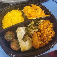 Features their vegan versions of their mac & cheese, chimichurri meatballs, cabbage wedge, lemon rice, channa masala, fish fillet, and broccoli. at Whole Foods Market in Detroit