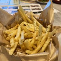 Truffle fries with no cheese powder. Truffle oil generous but not overpowering, standard truffle fries.   at Devil's Door in Seoul