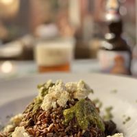 Wholewheat Venere rice with basil cream and vegan cheese at Osteria L'Angolo Divino in Rimini