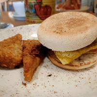 Vegan muffin (sausage patty, vegan cheese, hash browns) and bonus extra hash browns! at Boston Tea Party - Gloucester Road in Bristol