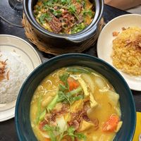 Yellow curry (bottom) & pumpkin tempeh clay pot (top)  at Mingle Cafe in Hue