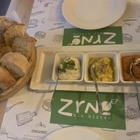 Three spreads w/homemade bread  at Zrno Bio Bistro in Zagreb