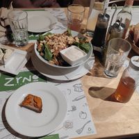 Caesar salad and three dips with bread at Zrno Bio Bistro in Zagreb