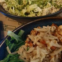 Pesto pasta & an amazing asian tofu dish. Excuse the terrible photo taken halfway through the meal! at Zrno Bio Bistro in Zagreb