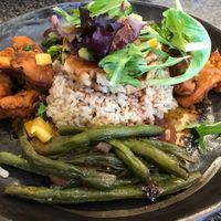 Spinach Tofu Cakes: Tofu patties w/ spinach, red pepper, spring onion & shiitake mushroom mixed together & served over steamed rice or brown rice w/ a raspberry soy sauce & greens on top & string beans & sweet potatoes on the side. at Mark's Kitchen in Takoma Park
