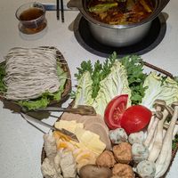 Ingredients platter, noodles, spicy hot pot soup base at One Leaf, One World 一叶一世界 - WenShu 文殊坊 in Chengdu