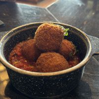 The Macaroni & “Cheese” Bites is now plated differently. Still good and has more of the chutney   at Walt Disney World - Geyser Point in Lake Buena Vista