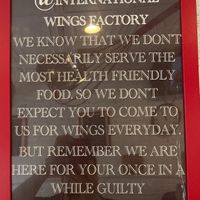 Sign in the store--this pretty much sums it up. at International Wings Factory in New York City