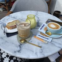 Iced latte with oat milk and vegan raspberry vanilla cake   at Luddites Books & Wine in Antwerpen
