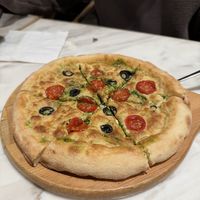Pizza with basil, tomatoes and olives oil  at Ru Pure Vegan - 博华广场店 in Shanghai