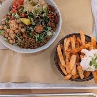 Earthly eats bowl and side of fries with vegan sauce at Kayma Algerian Eatery in San Francisco