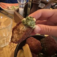 Chickpea balls w vegan pesto sauce sooo goodd  at Taverna 51 in Rome