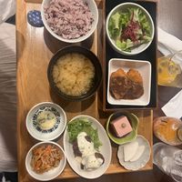 Manzoku Gozen Set with karaage, kurumabu with dark miso sauce, salad, kinpira gobou, tofu, potato salad, daikon and miso soup  at Komaki Shokudo in Tokyo