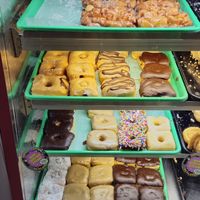 All Vegan donuts on green tray. Flavors such as Boston Cream, Glazed, Lemon, Chocolate Sprinkled, Maple, Powdered, and more. at Donut Land in Tualatin