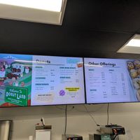 Menu board with pricing December 2025 at Donut Land in Tualatin