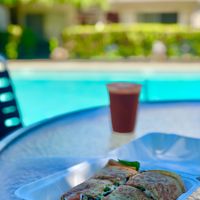 My Royal Veggie Crepe w/ Daiya Cheese & freshly juiced carrot juice! Amazing!! Beautiful! Full of flavor!! The crepe’s double-deckered—you’re only seeing the TOP LAYER!!! at Crepes Bistro in Santa Clara