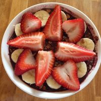 Açaí bowl with strawberries, bananas, and granola at Crepes Bistro in Santa Clara